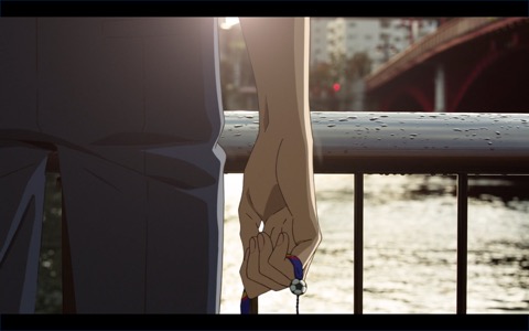 (Kazuki stands by the river, soccer miçanga in hand)